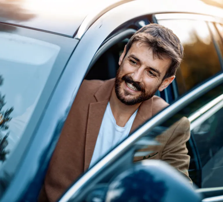 Businessman in car.Young businessman test drive new car.