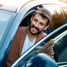 Businessman in car.Young businessman test drive new car.
