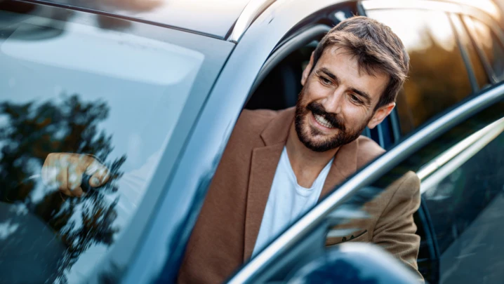Businessman in car.Young businessman test drive new car.